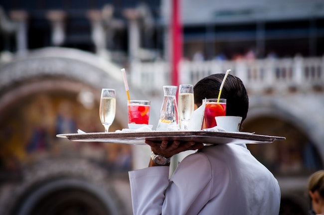 Waiter serving drinks